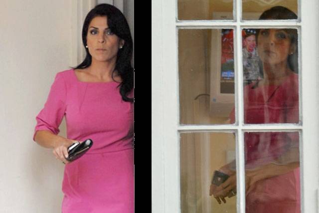 Jill Kelley at her home in Tampa; you can see a reflection of a TV news report about Petraeus scandal in the photo on the right